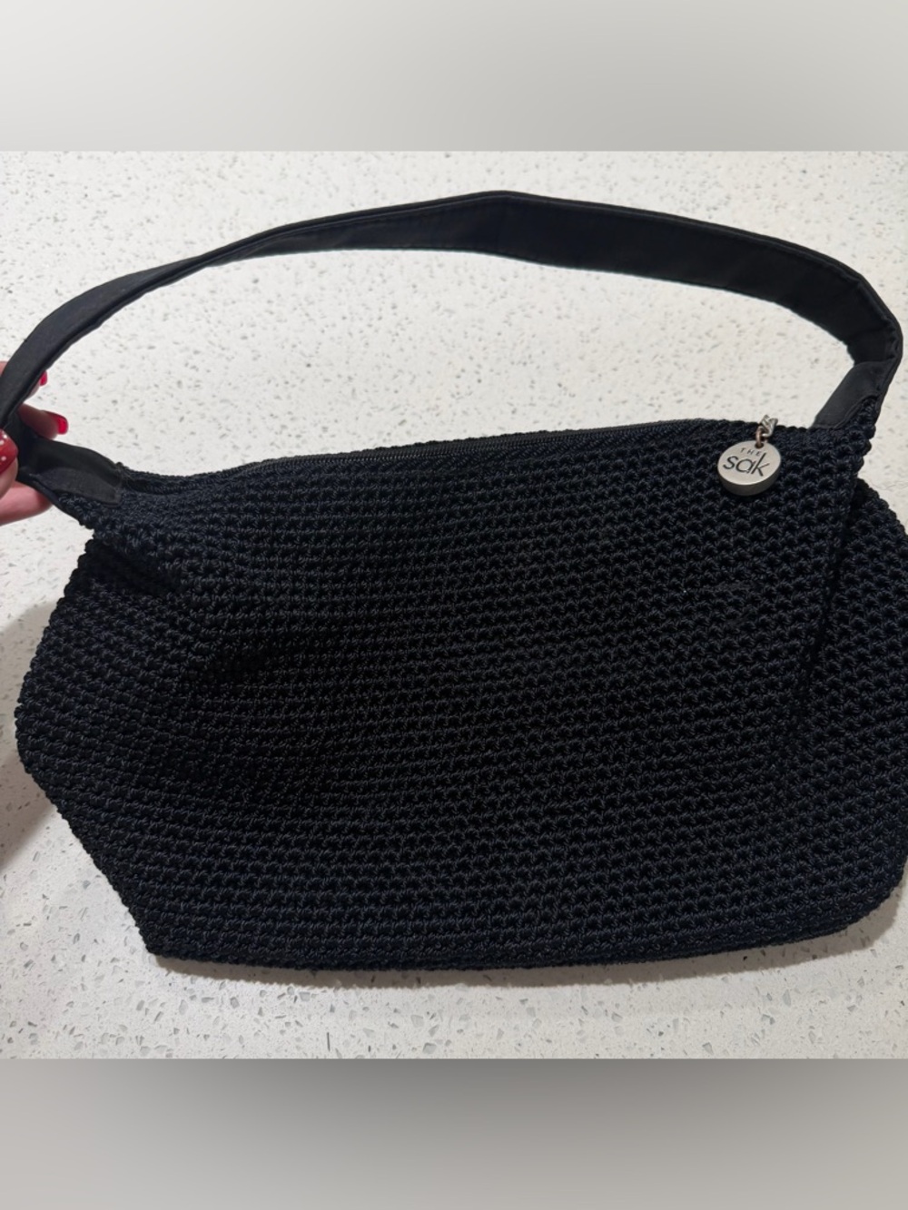 The Sak Black Crochet Shoulder Bag with Branded Charm